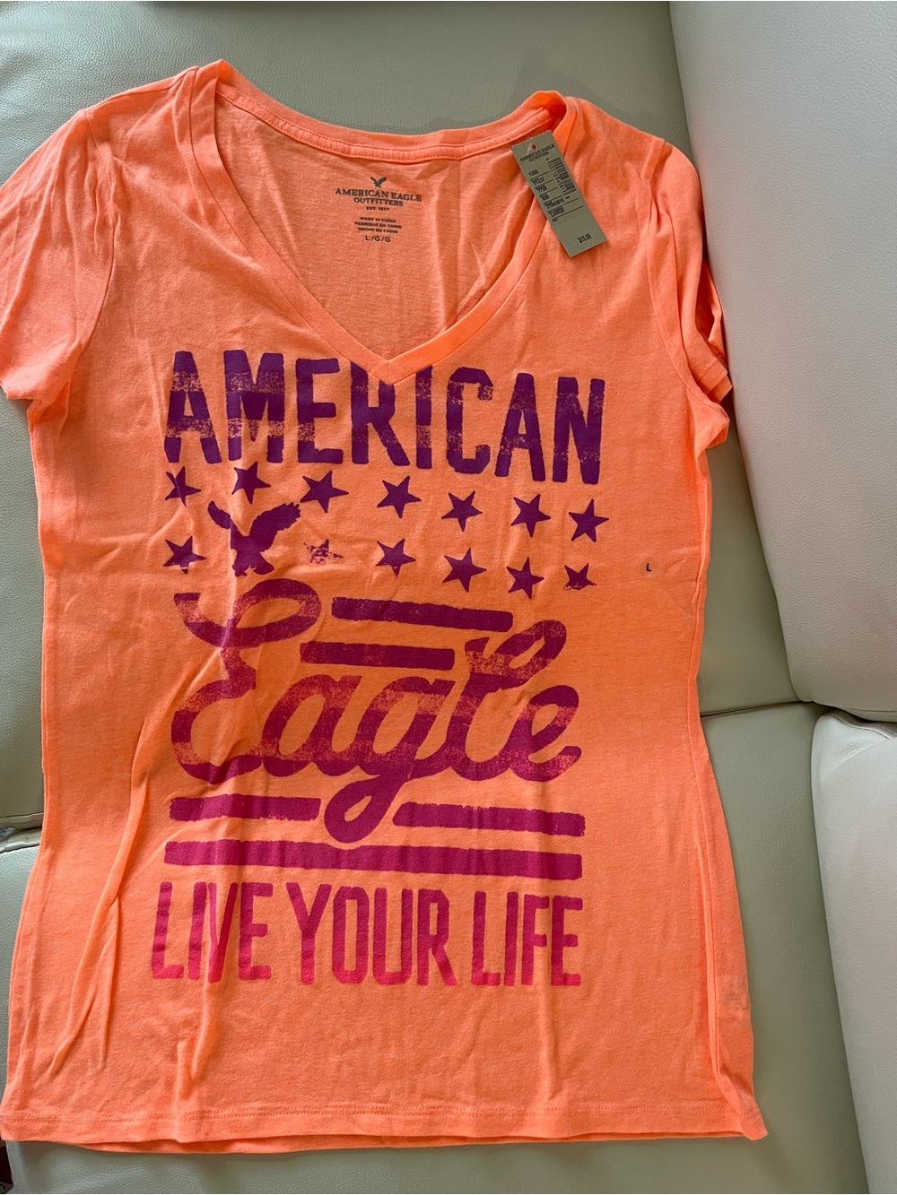 American Eagle Outfitters Neon Orange V-Neck Graphic Tee with Purple Print